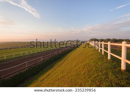 Horse Racing Tracks  Horse racing training tracks sand and grass landscape in morning sunrise colors