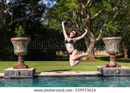Girl Jumping Pool Girl Teenager running jumping into swimming pool summer playtime