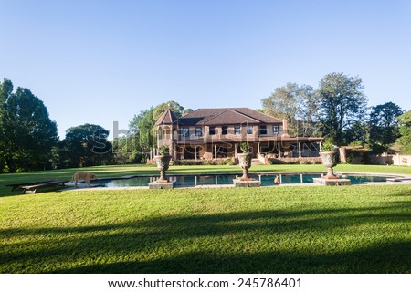 Scenic countryside home mansion home with open lawn trees swimming pool