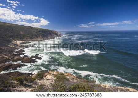 Ocean Rocky Cliffs Rocky cliffs coastline landscape with blue ocean waves