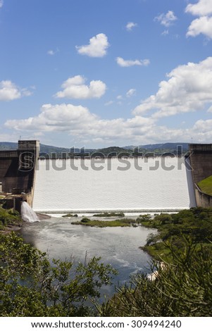 Dam Wall Water\
Dam wall full flowing river water power over weir wall into summer valley.