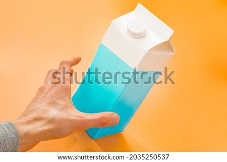 Similar – Image, Stock Photo Man taking milk box from the fridge