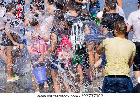 Odessa, Ukraine - 1 July 2015:  Openair water battle. Many happy people play pour water on each other celebrating festival