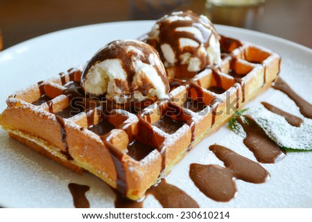 Belgian waffle with ice cream, chocolate and mint