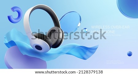 Wireless over ear headphone ad. 3D Illustration of over ear headphones displayed in front of floating fabric on blue background