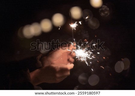 Image, Stock Photo Burning sparkler against black background