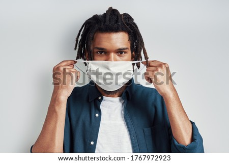 Image, Stock Photo Man with face mask and gloves looking out the window