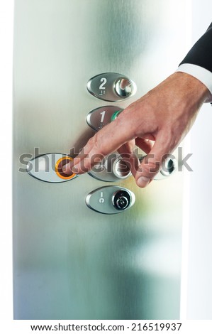 Man pushing button. Close-up of male hand pushing button of elevator