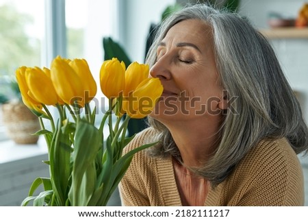 Image, Stock Photo Carefree woman with flowers on hill