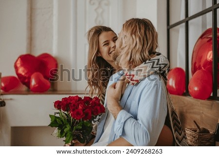 Similar – Image, Stock Photo Loving couple embracing on sofa at home