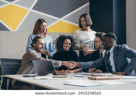 Similar – Image, Stock Photo Ethnic happy businessman shaking hands with partner and looking at camera