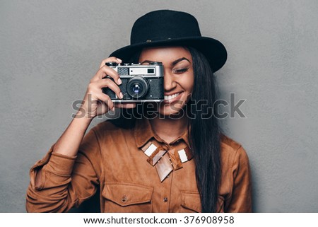 Similar – Image, Stock Photo Positive ethnic woman photographing on retro camera in city park