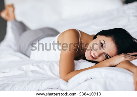 Similar – Image, Stock Photo Lying smiling woman with petals on face