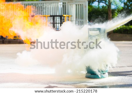 How to use a fire extinguisher with  gas container during training.