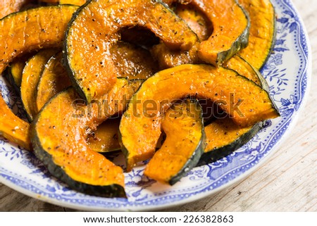 Roasted slices of pumpkin on a serving plate