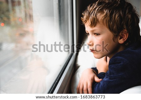 Similar – Image, Stock Photo Sad boy looking down in studio