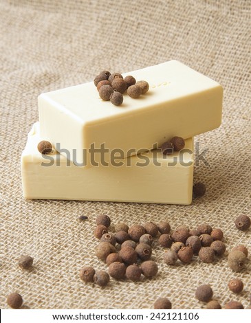 Cubeb soap. Dried cubeb in the background