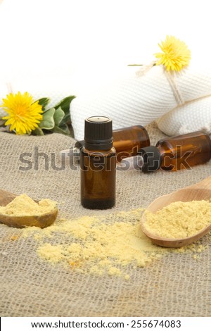 A dropper bottle of mustard oil on a sackcloth