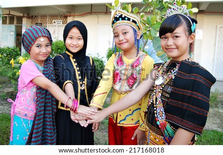 KOTA KINABALU, MALAYSIA - SEPTEMBER 12 : Children of SK Kolombong in Malaysia multirace costumes to commemorate Malaysia Day on September 12, 2014 in Kota Kinabalu, Sabah, Malaysia.