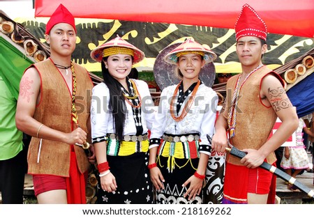 Sipitang, Sabah Malaysia.August 30, 2014 : Young people from the Lundayeh ethnic of Sabah in their traditional costume stands in front of their booth during GaTa festival in Sipitang Sabah Malaysia.