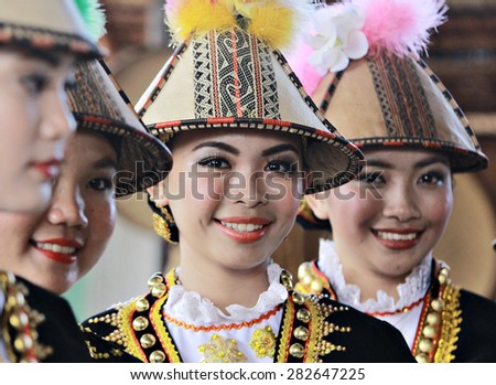 Kota Kinabalu, Malaysia - May 30, 2015: Kadazan Papar ladies in their traditional costume pose for the camera during the Sabah State Harvest festival celeberation in Kota Kinabalu, Sabah, Malaysia.