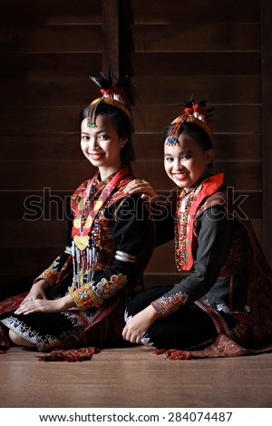 Kota Kinabalu, Sabah Malaysia.May 31, 2015 : Dusun Lotud girls in colorful traditional costume during Pesta Kaamatan or Harvest Festival in Sabah Borneo. Image contains shadow from natural lights.