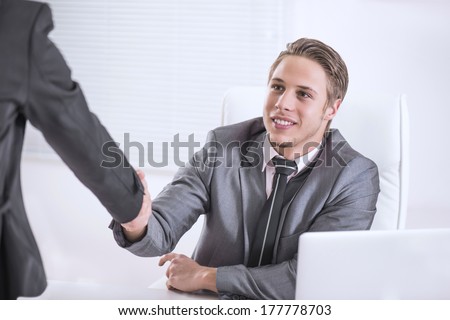 People shaking hands during business interview