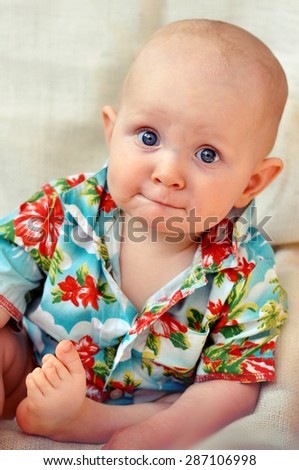Baby boy wearing hawaiian shirt