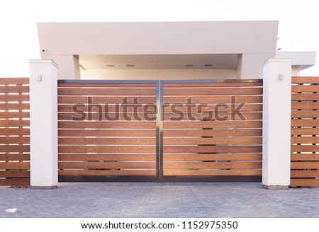 Similar – Image, Stock Photo old closed garden gate with wire mesh fence and hole