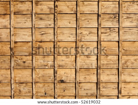 The wood siding of an old style Japanese house.  The wood is new but had been burned to give the appearance of being older.