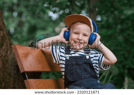 Similar – Image, Stock Photo Cheerful little boy with dumbbells