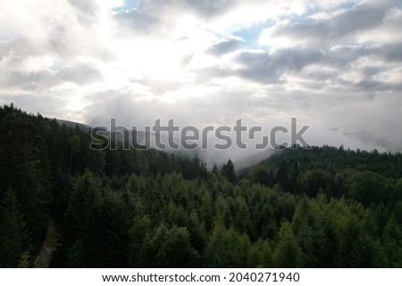 Similar – Foto Bild Sonne scheint am nebligen Morgen über den Bergen