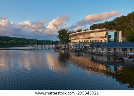 Dzamgarovskiy pond, Moscow, Russia - July 02, 2015: Large restaurant and cafe Aurora on the beach of the large pond in Moscow just before sunset.