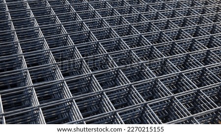 Wire mesh piles for construction. BRC welded steel wire mesh for concrete slab reinforcement of construction construction site in top view with natural light and selective focus. Foto d'archivio © 