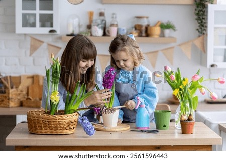 Similar – Foto Bild Kleine Tochter macht mit der Mutter zu Hause einen handgemachten Pompon