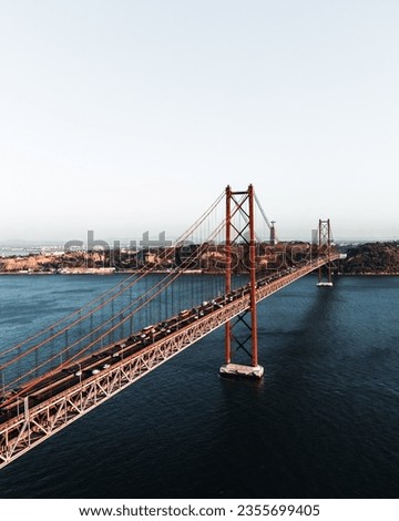 Similar – Foto Bild Ponte 25 de Abril Brücke in Lissabon während Sonnenuntergang mit Schiff und Jesus-Denkmal, bewölkten Himmel portugal