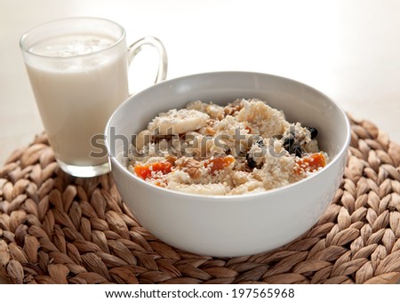 Milk and cottage cheese with dried fruit and  banana. Useful dietary breakfast