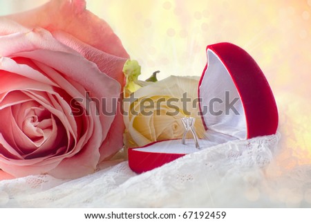 Box with diamond ring in roses