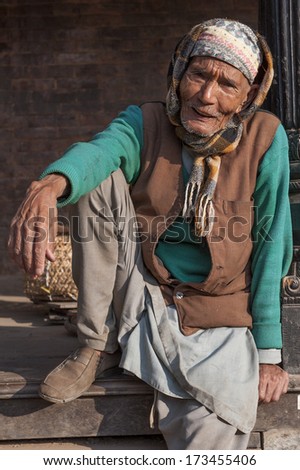 BHAKTAPUR, NEPAL - NOV 7 : Unidentified Nepali old man pose for camera in Bhaktapur, Nepal on November 7, 2012.