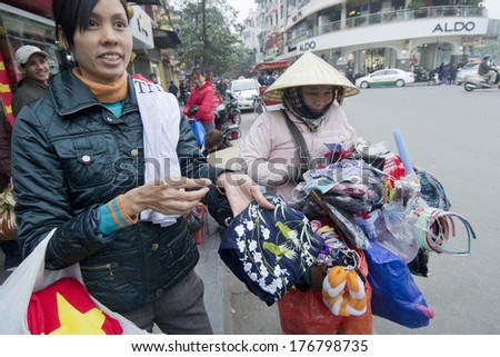 HANOI, VIETNAM - JANUARY 8: Unidentified street seller on January 8, 2011 in Hanoi, Vietnam.