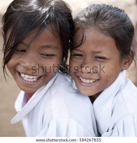 KAMPONG PHLUK,CAMBODIA-DEC 24:Portrait of an unidentified Khmer girls on Tonle Sap Lake in Kampong Phluk,Cambodia on December 24,2011.It is the largest lake in Southeast Asia (up to 16,000 square km).