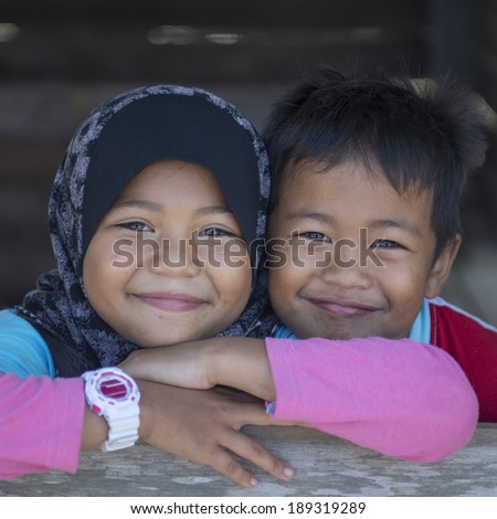 TERENGGANU, MALAYSIA - APRIL 9, 2014: Portrait of an unidentified Malay ethnic  in Terengganu, Malaysia. The Malays, make up Malaysia\'s largest ethnic group, which is more than 50% of the population.