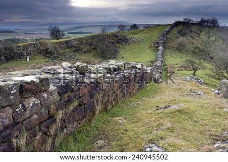 Hadrian\'s wall built by Roman\'s to protect northern borders of British Isle was extending from west coast to east coast of the Great Britain. Remainings of the wall near Walton Quarry, Northumberland