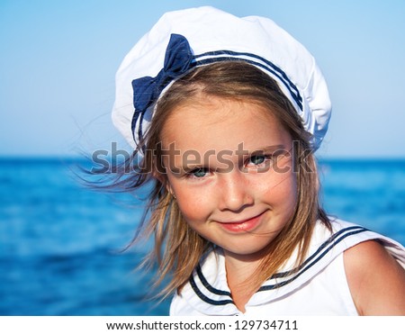 Portrait of a preschool girl in sailor clothing