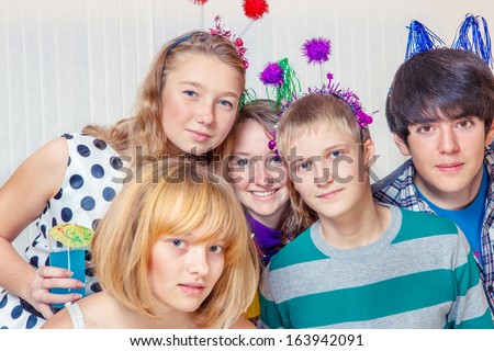 Portrait of high school students group with party decoration on their heads