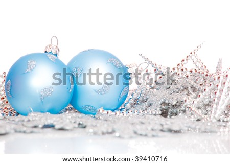 Blue Christmas balls among silver glittering decoration
