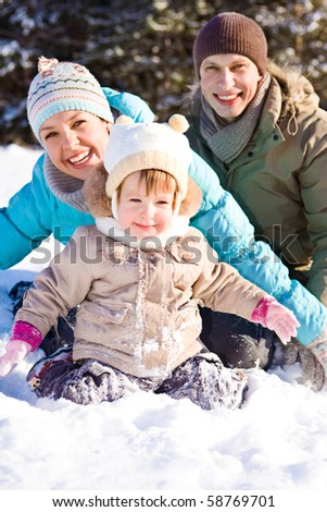 Joyful family enjoying time in winter park
