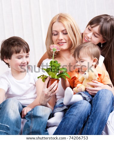 Kids presented mother a Gerber flower