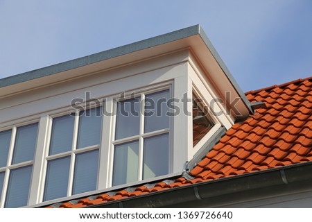dormer on red roof with latticed window Stock foto © 
