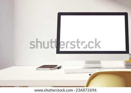 the computer is on the table in a bright interior